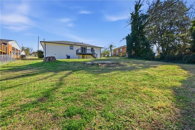 a aerial view of a house with a yard