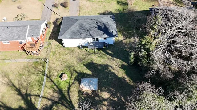 an aerial view of a house with swimming pool