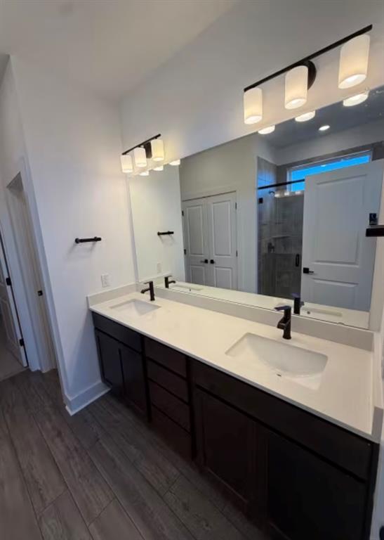 151 Sincere Drive Kyle, TX 78640 - Photo 6 of 15 a bathroom with a sink and a mirror
