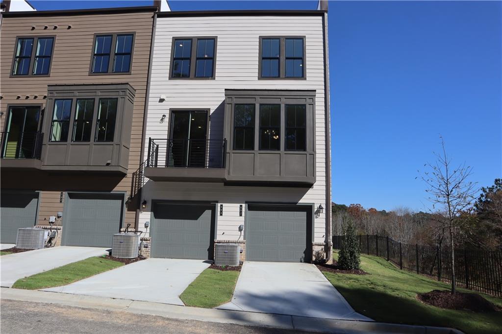 692 Urban Grange Way Suwanee, GA 30024 - Photo 22 of 23 a front view of a house with a yard
