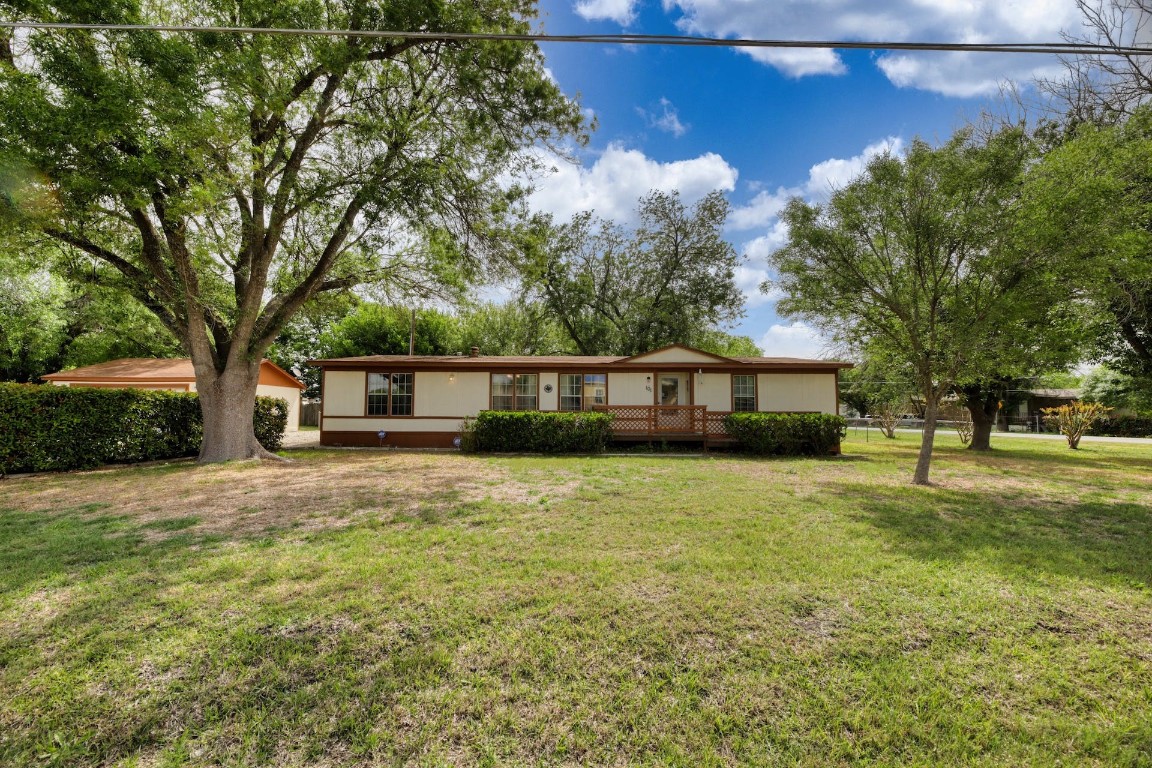 101 Red Bird Trail Kyle, TX 78640 - Photo 1 of 1 a front view of a house with a garden