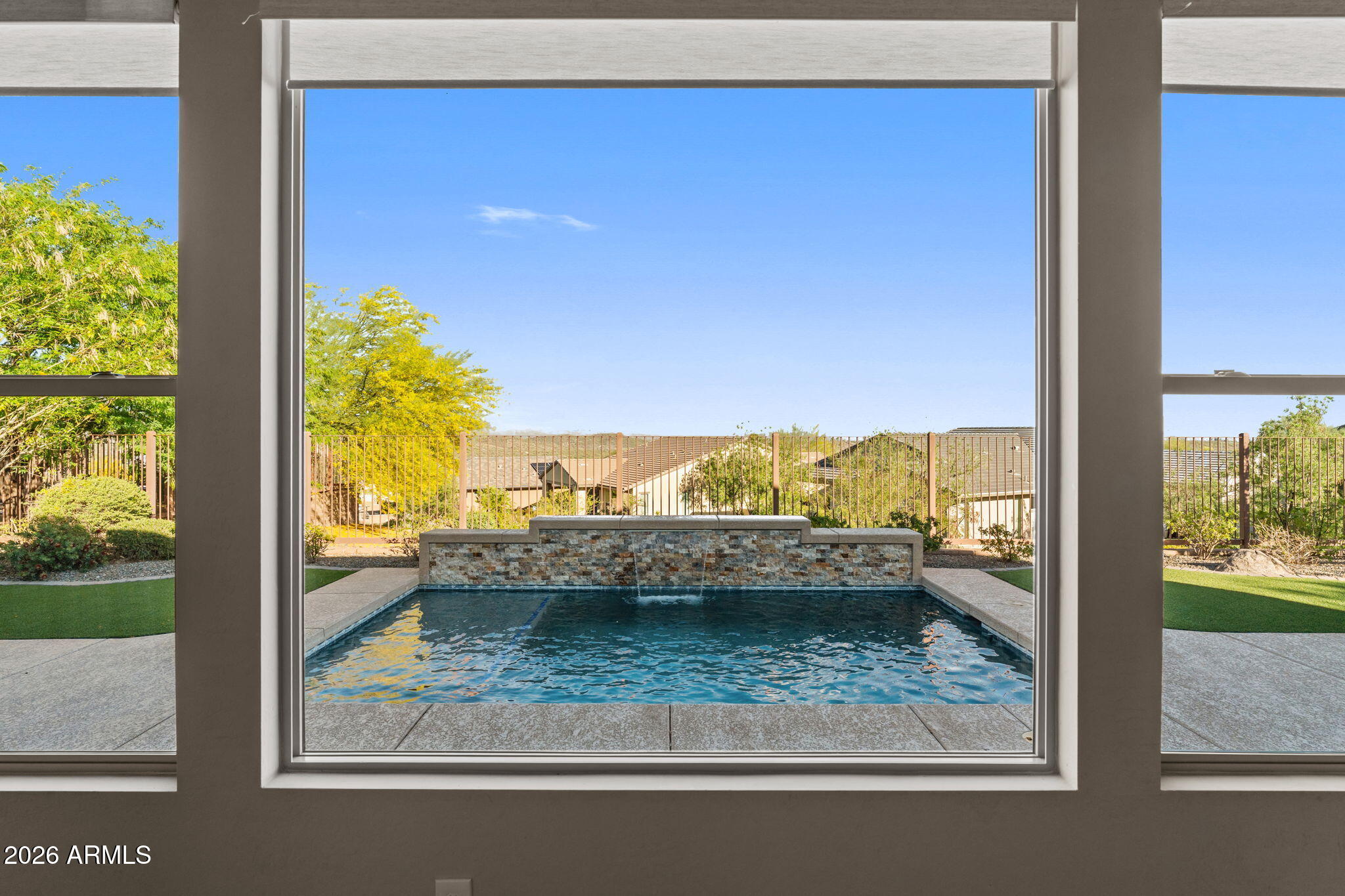 3675 Gold Ridge Road Wickenburg, AZ 85390 - Photo 20 of 58 a view of a glass door next to a yard
