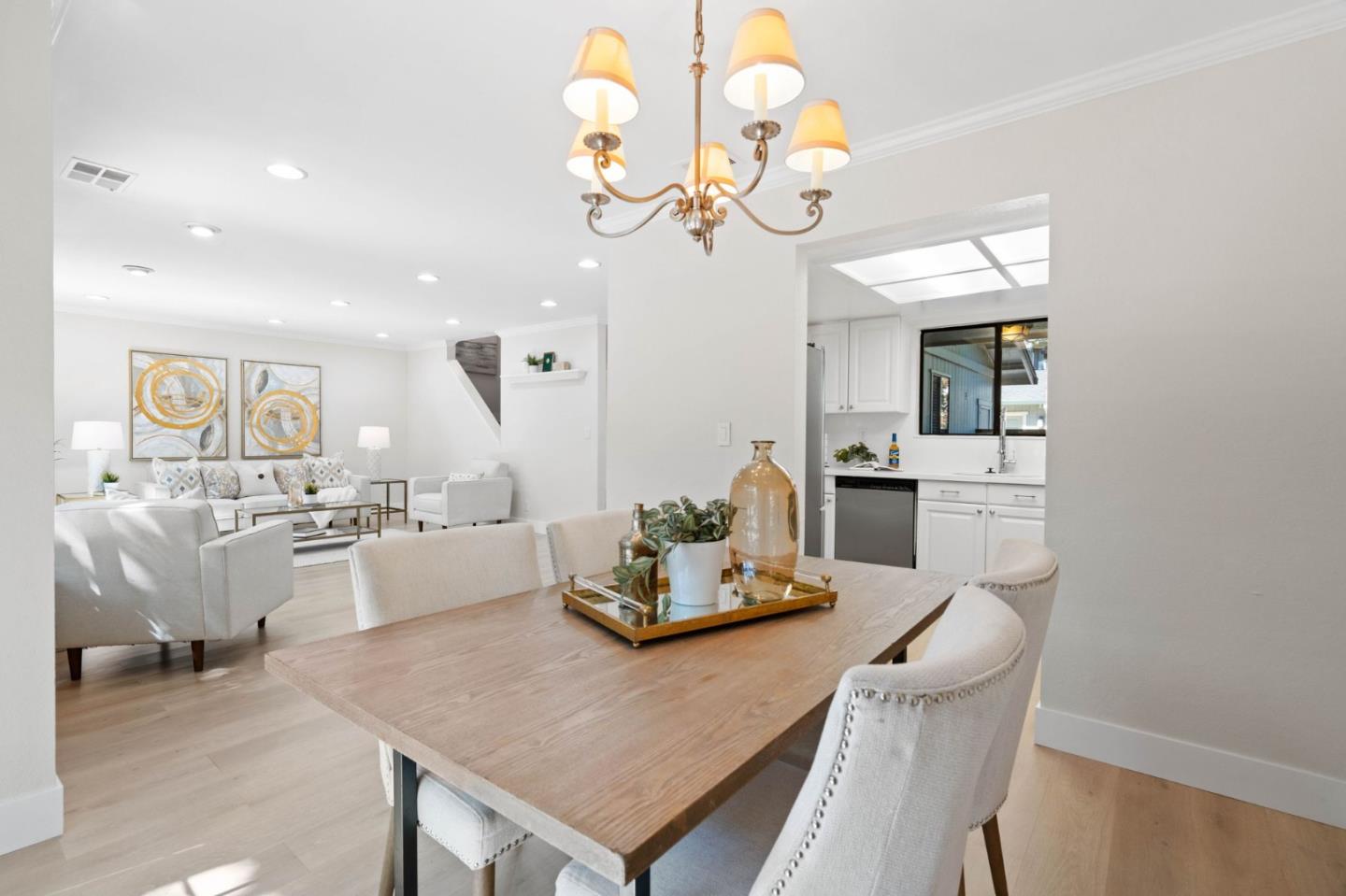 1165 Smith Avenue, Unit B Campbell, CA 95008 - Photo 15 of 46 a kitchen with a dining table cabinets and stainless steel appliances