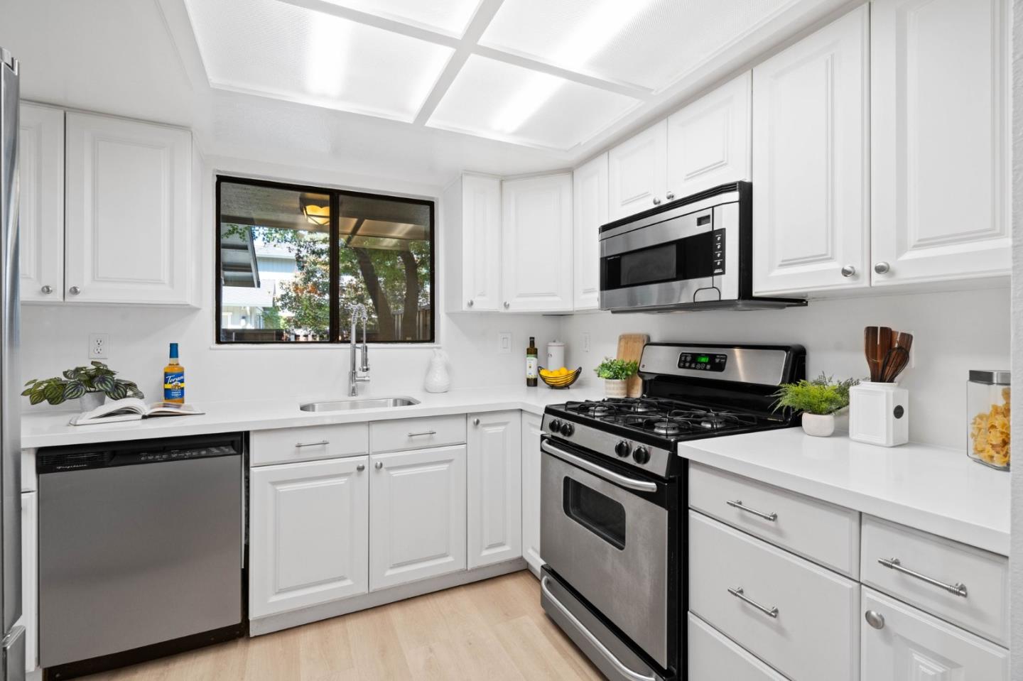 1165 Smith Avenue, Unit B Campbell, CA 95008 - Photo 20 of 46 a kitchen with white cabinets and white appliances