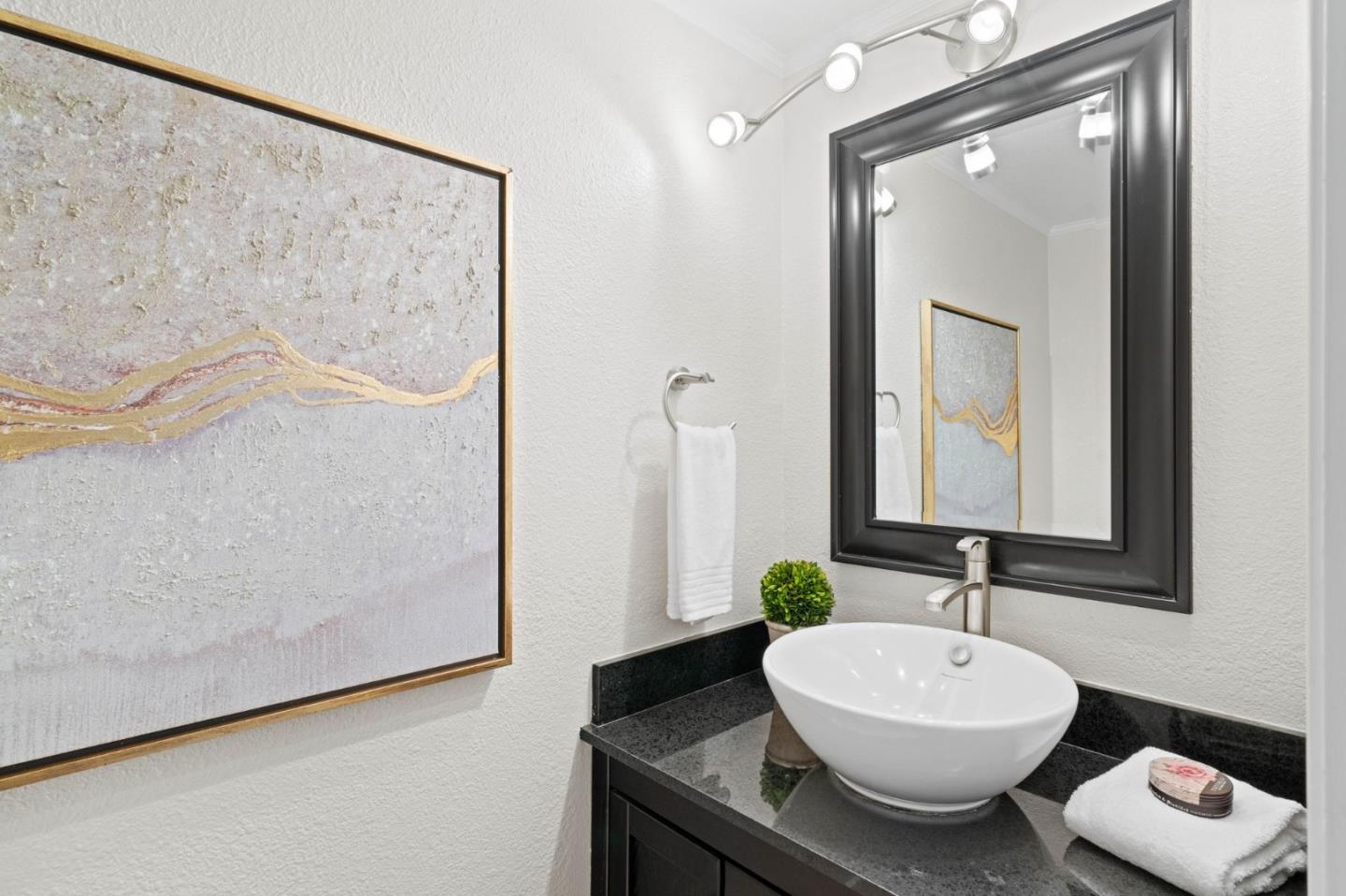 1165 Smith Avenue, Unit B Campbell, CA 95008 - Photo 25 of 46 a bathroom with a sink and a mirror