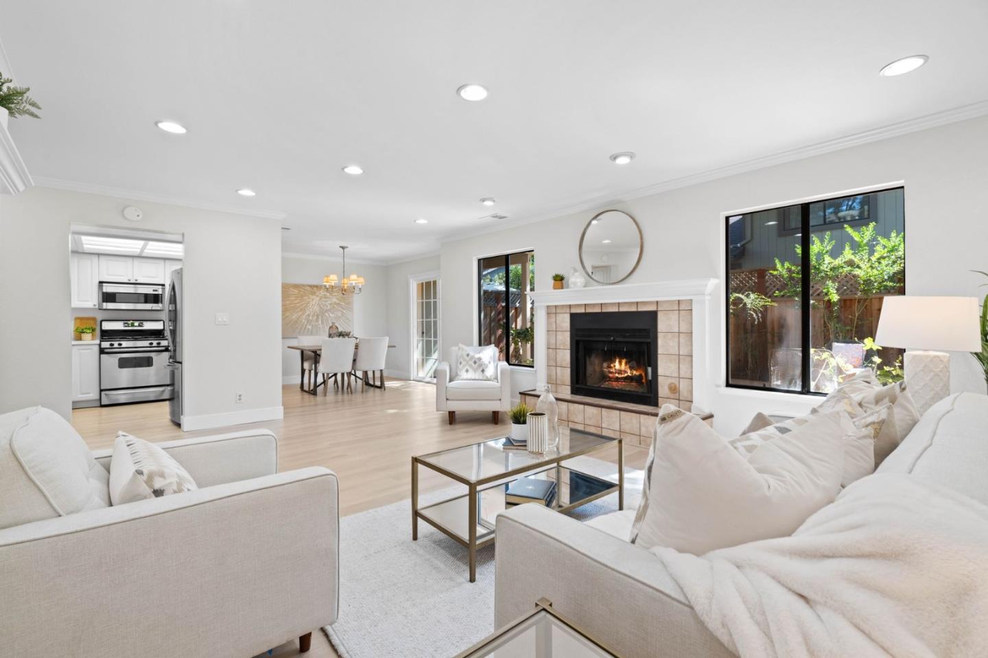 1165 Smith Avenue, Unit B Campbell, CA 95008 - Photo 27 of 46 a living room with furniture a fireplace and a flat screen tv