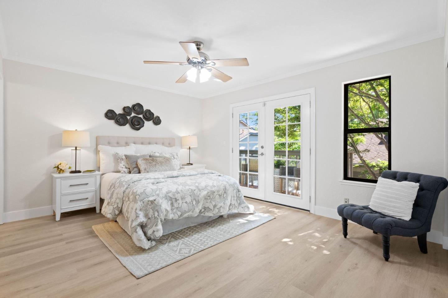 1165 Smith Avenue, Unit B Campbell, CA 95008 - Photo 32 of 46 a spacious bedroom with a bed and a chandelier