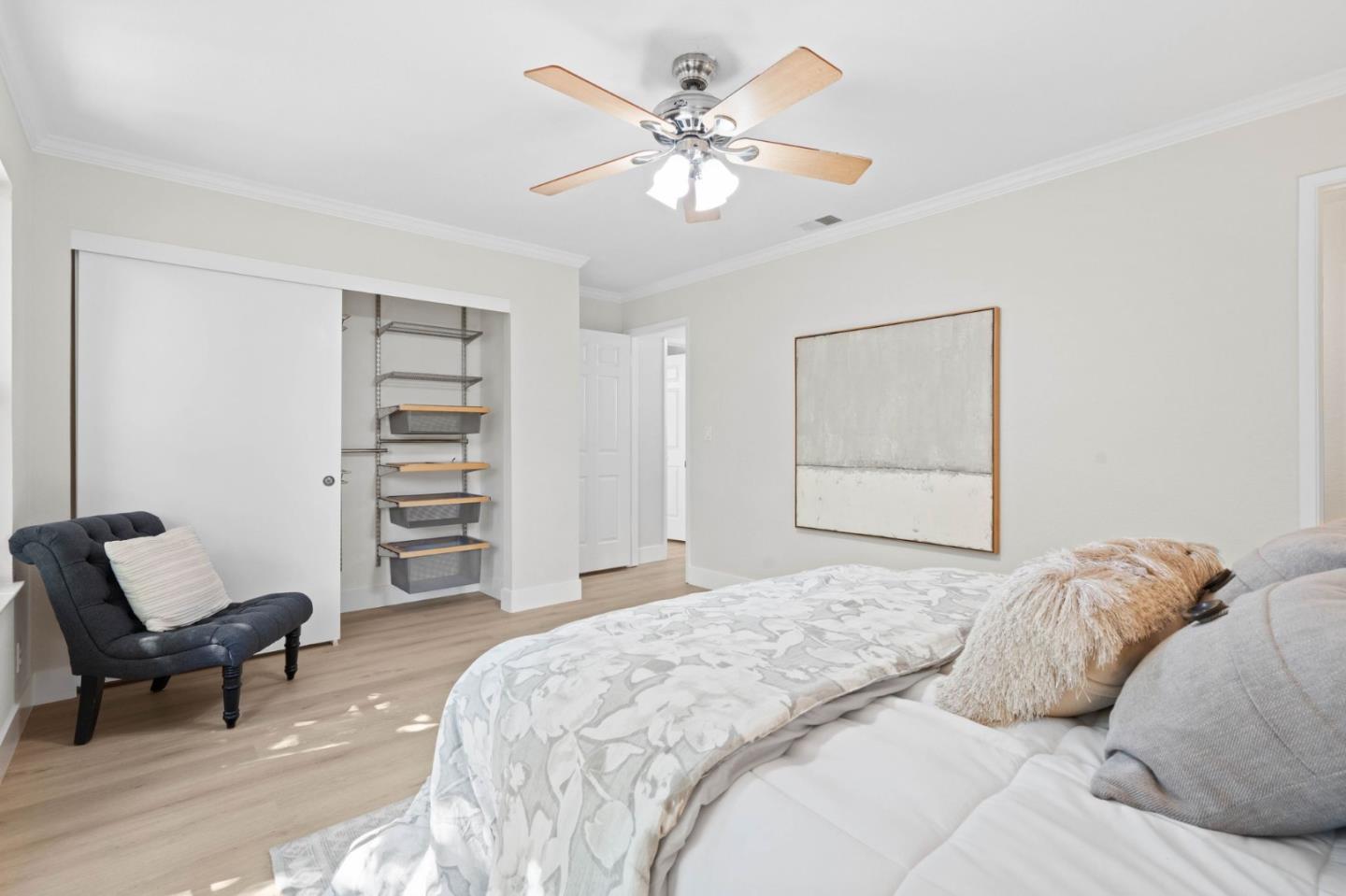 1165 Smith Avenue, Unit B Campbell, CA 95008 - Photo 33 of 46 a bedroom with a bed a chair and a chandelier