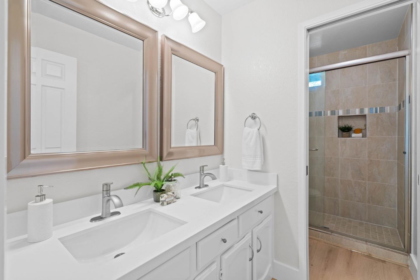 1165 Smith Avenue, Unit B Campbell, CA 95008 - Photo 34 of 46 a bathroom with a double vanity sink mirror and shower