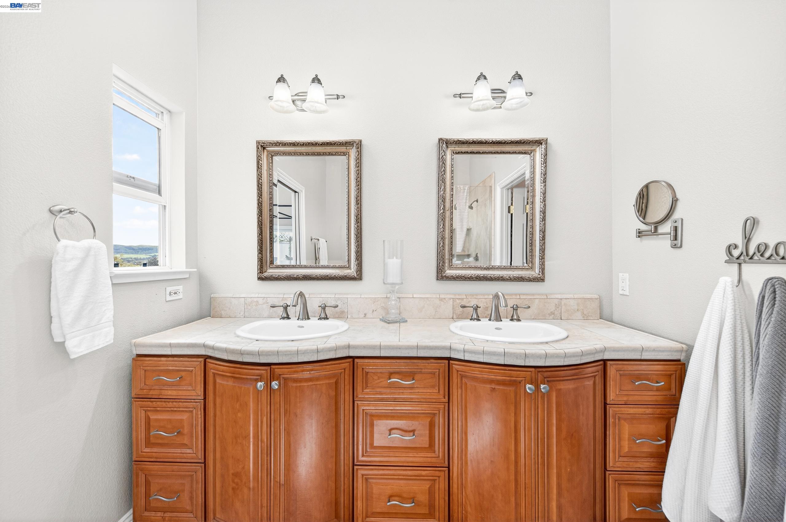 10700 Foothill Road Sunol, CA 94586 - Photo 16 of 60 a bathroom with 2 sink and a mirror