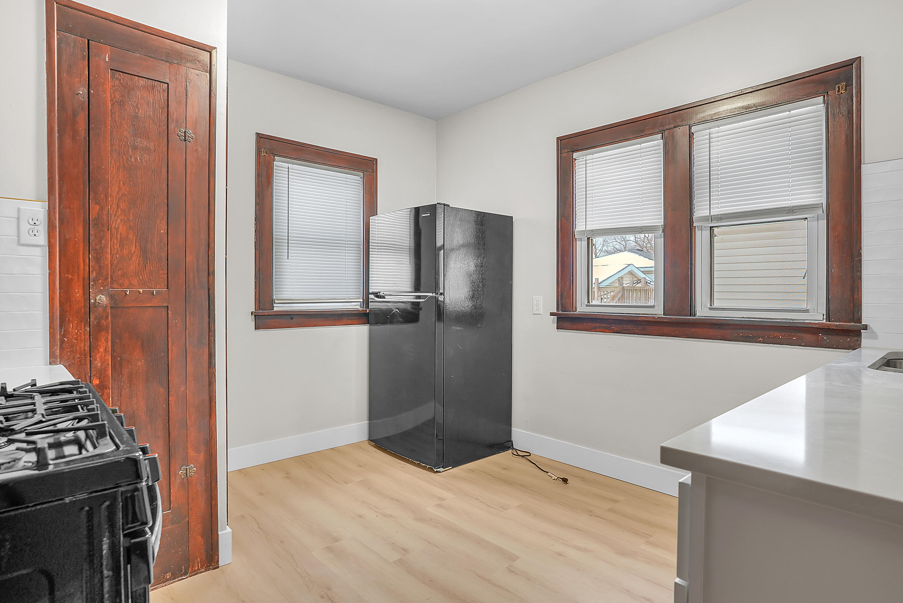 7511 Monroe Avenue Hammond, IN 46324 - Photo 8 of 20 a view of kitchen with window and refrigerator