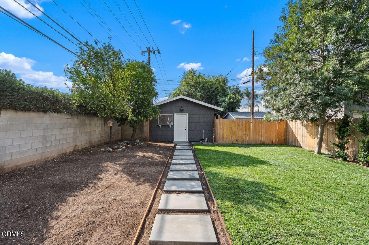 114 West 3rd Street San Dimas, CA 91773 - Photo 18 of 23 a front view of a house with a yard