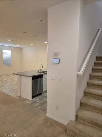 a view of a hallway with a window