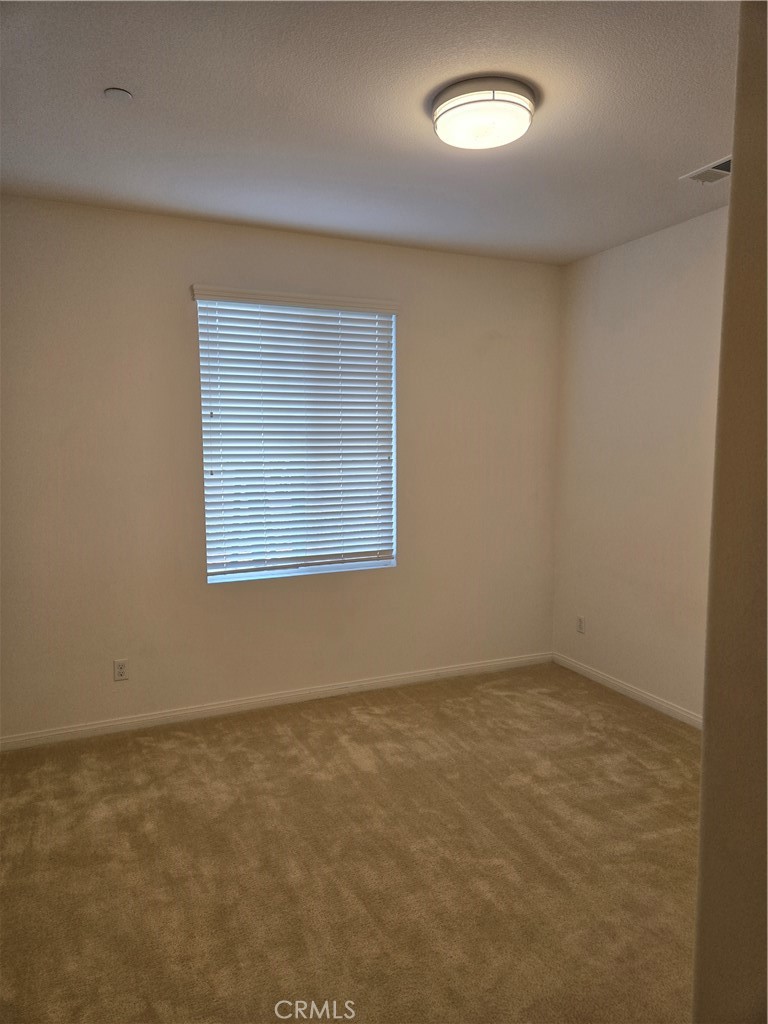 11014 Via Del Corso Riverside, CA 92505 - Photo 22 of 30 an empty room with a window