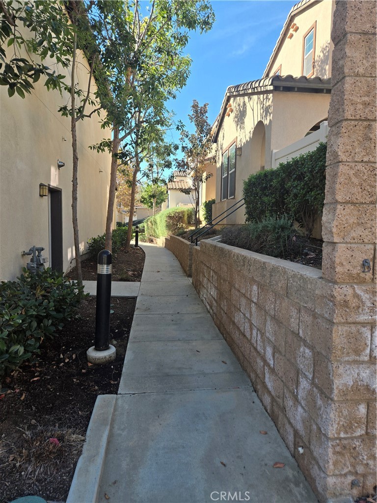 11014 Via Del Corso Riverside, CA 92505 - Photo 27 of 30 a view of a pathway with house on both side