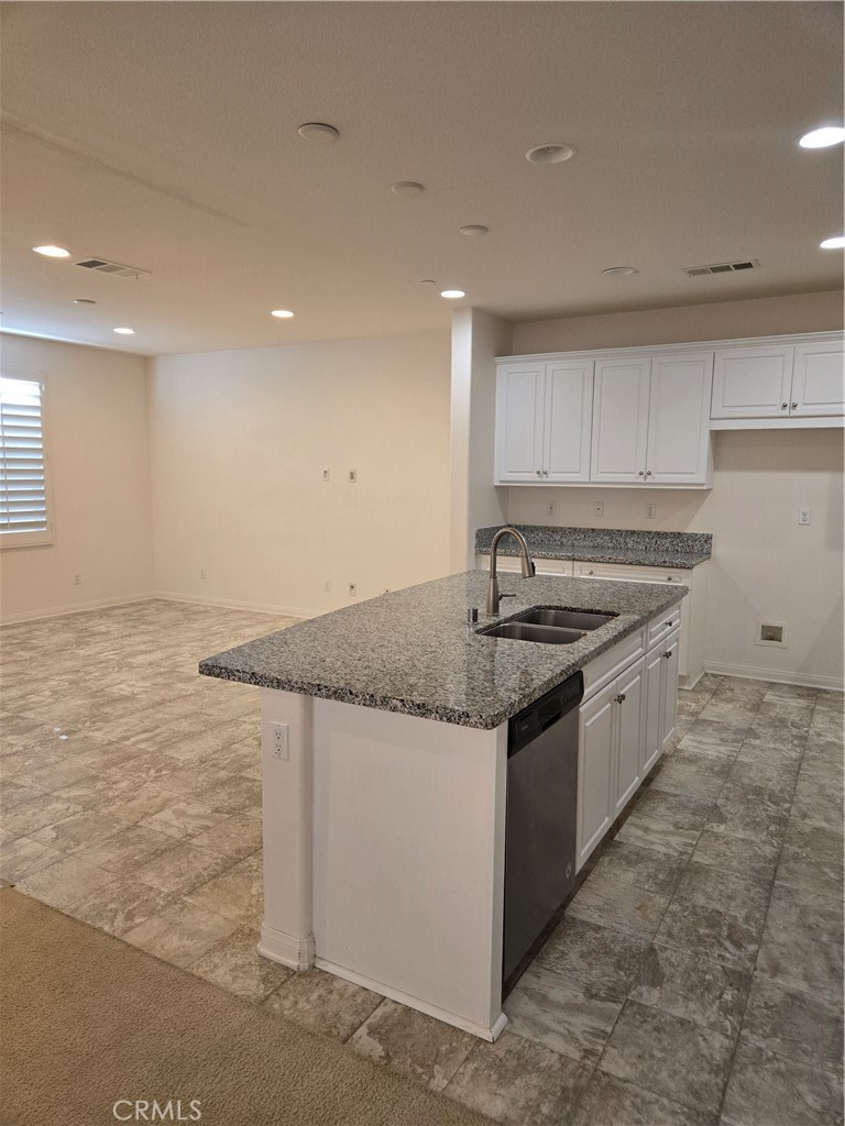 11014 Via Del Corso Riverside, CA 92505 - Photo 7 of 30 a kitchen with stainless steel appliances granite countertop a sink and a stove