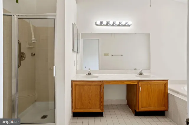 a bathroom with a tub and a sink