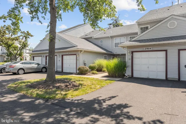 a house with a large tree in front of it