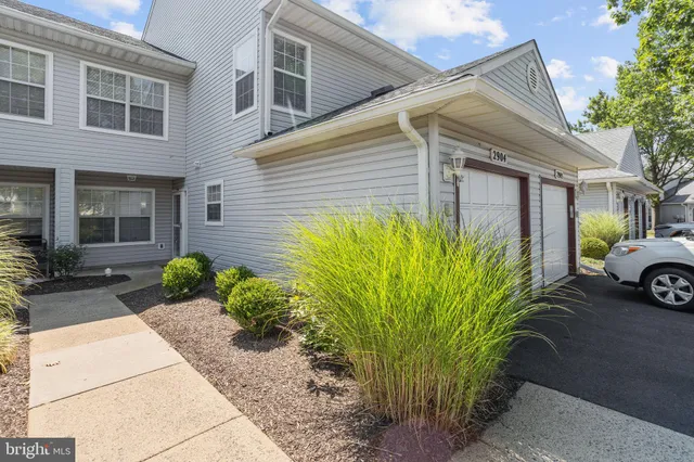 a view of a house with bunch of plants