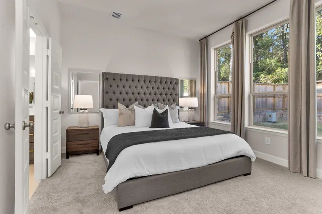 a bedroom with a bed and a dresser