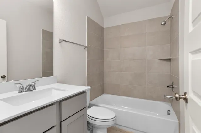 a bedroom with bed and glass door