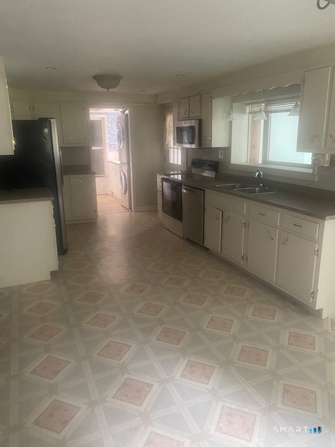 107 Tower Road Brookfield, CT 06804 - Photo 13 of 19 a kitchen with stainless steel appliances granite countertop a sink refrigerator and cabinets