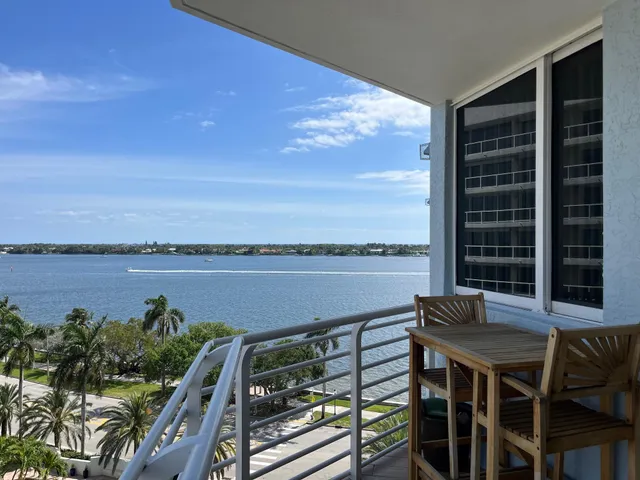 a terrace with outdoor seating and water view