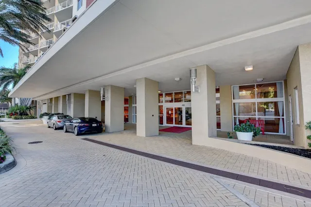 a bedroom with furniture and a large window