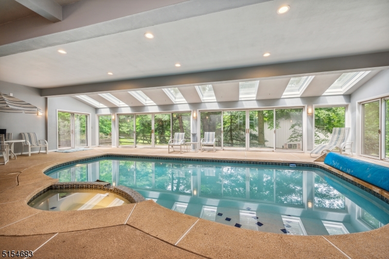 a large window with swimming pool in front of it