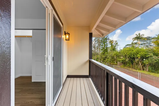 a view of a balcony with wooden floor