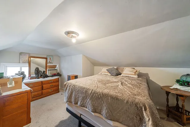 a bed room with a bed and furniture