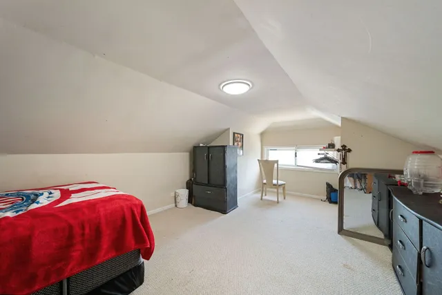 a room with a bed and a chair