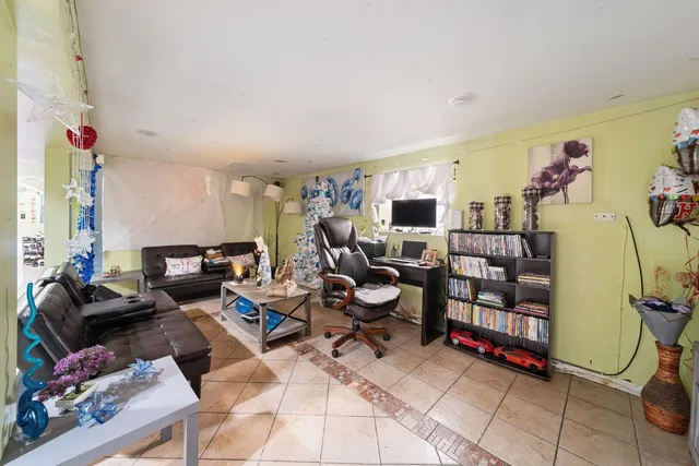 a living room with lots of furniture and gym equipment