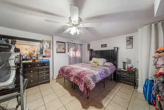 a bedroom with a bed and a walk in closet