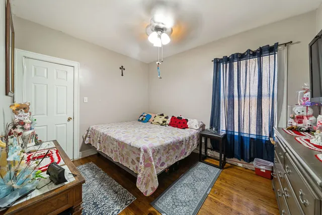 a bedroom with bed and a window