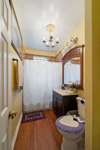 a bathroom with a sink toilet and shower
