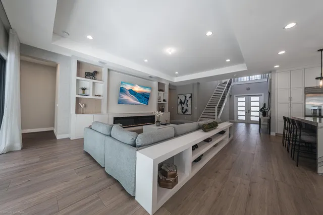 a bedroom with furniture and a chandelier