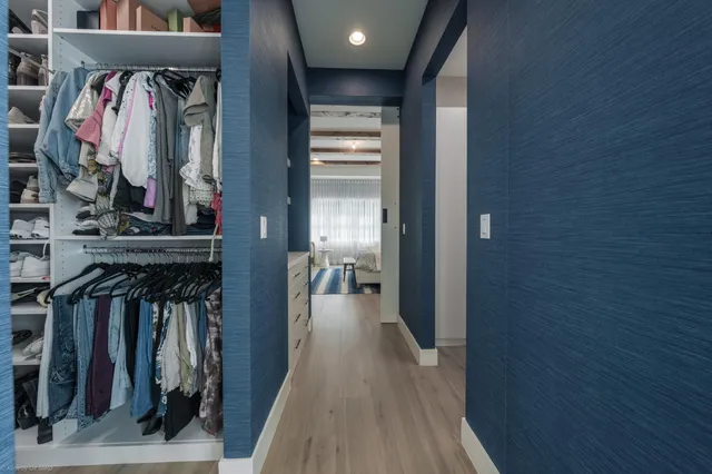 a room with wooden floor and furniture