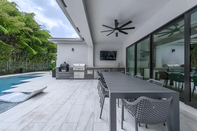 a view of a house with a yard and sitting area