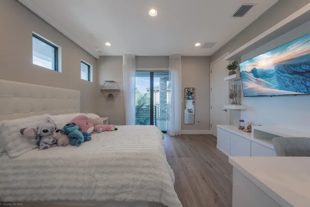 an aerial view of a house with outdoor space and lake view