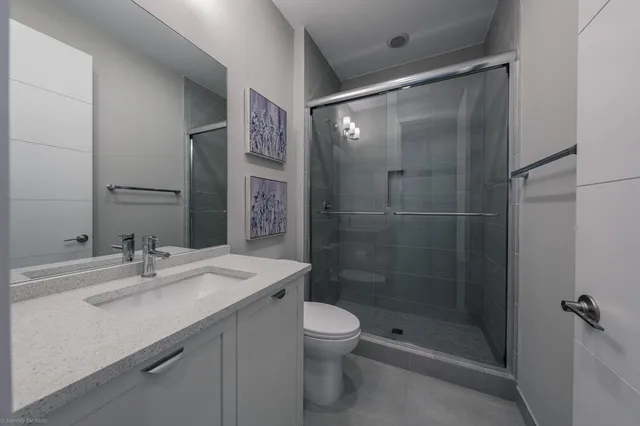 an aerial view of a house with a yard basket ball court and outdoor seating