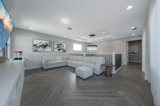 a kitchen with stainless steel appliances granite countertop a sink and a stove