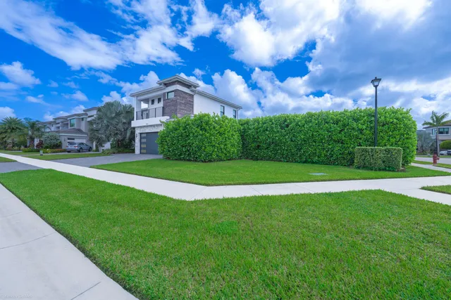 a large kitchen with a table and chairs