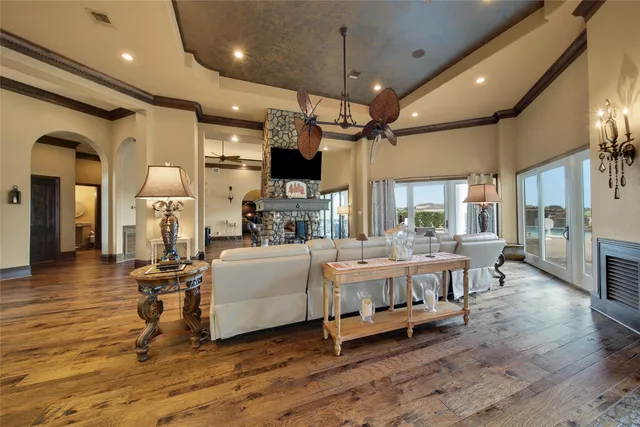 a living room with furniture and a chandelier
