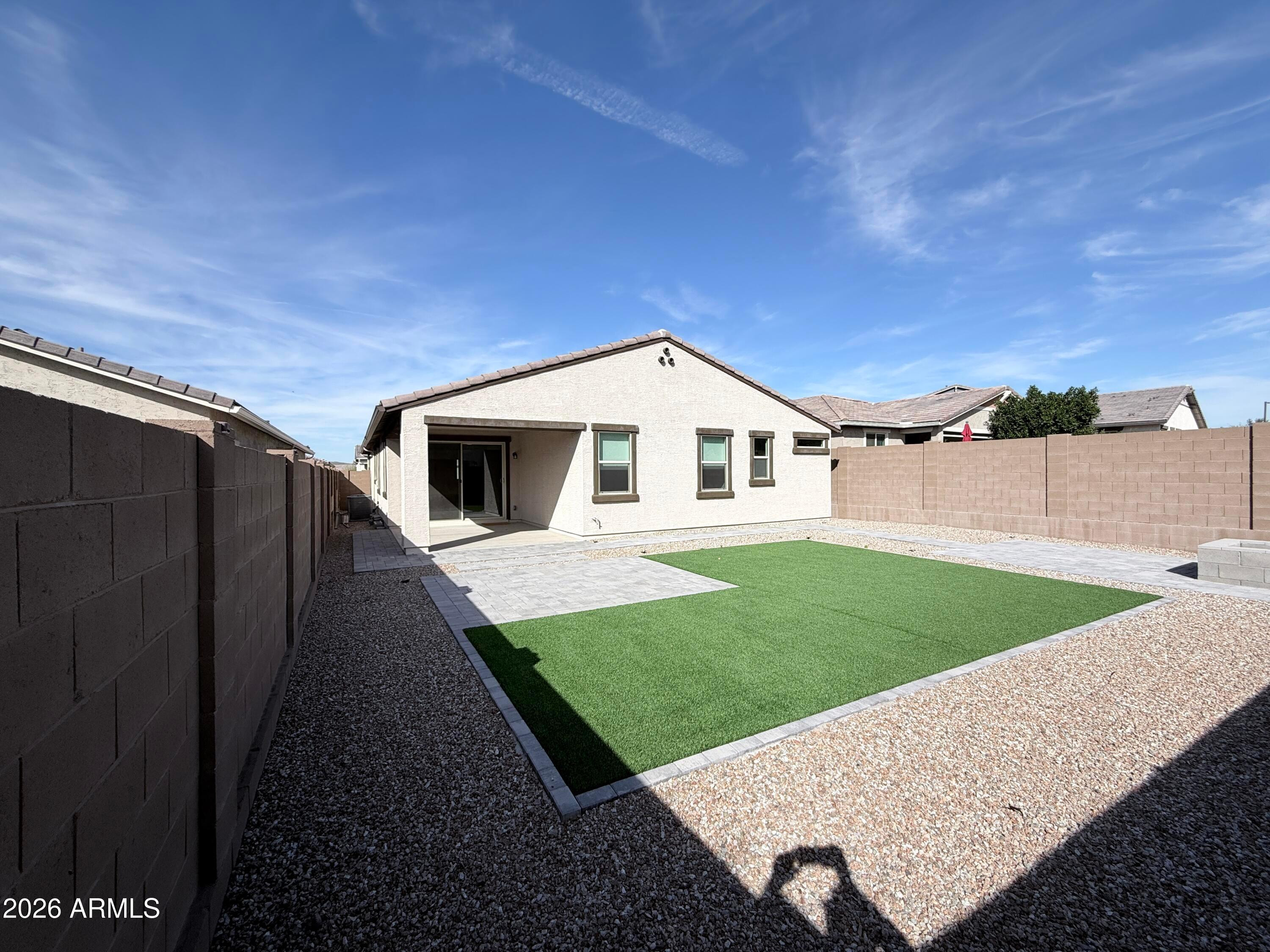 4323 West Palace Sta Road New River, AZ 85087 - Photo 19 of 20 a view of a backyard with plants and a bench
