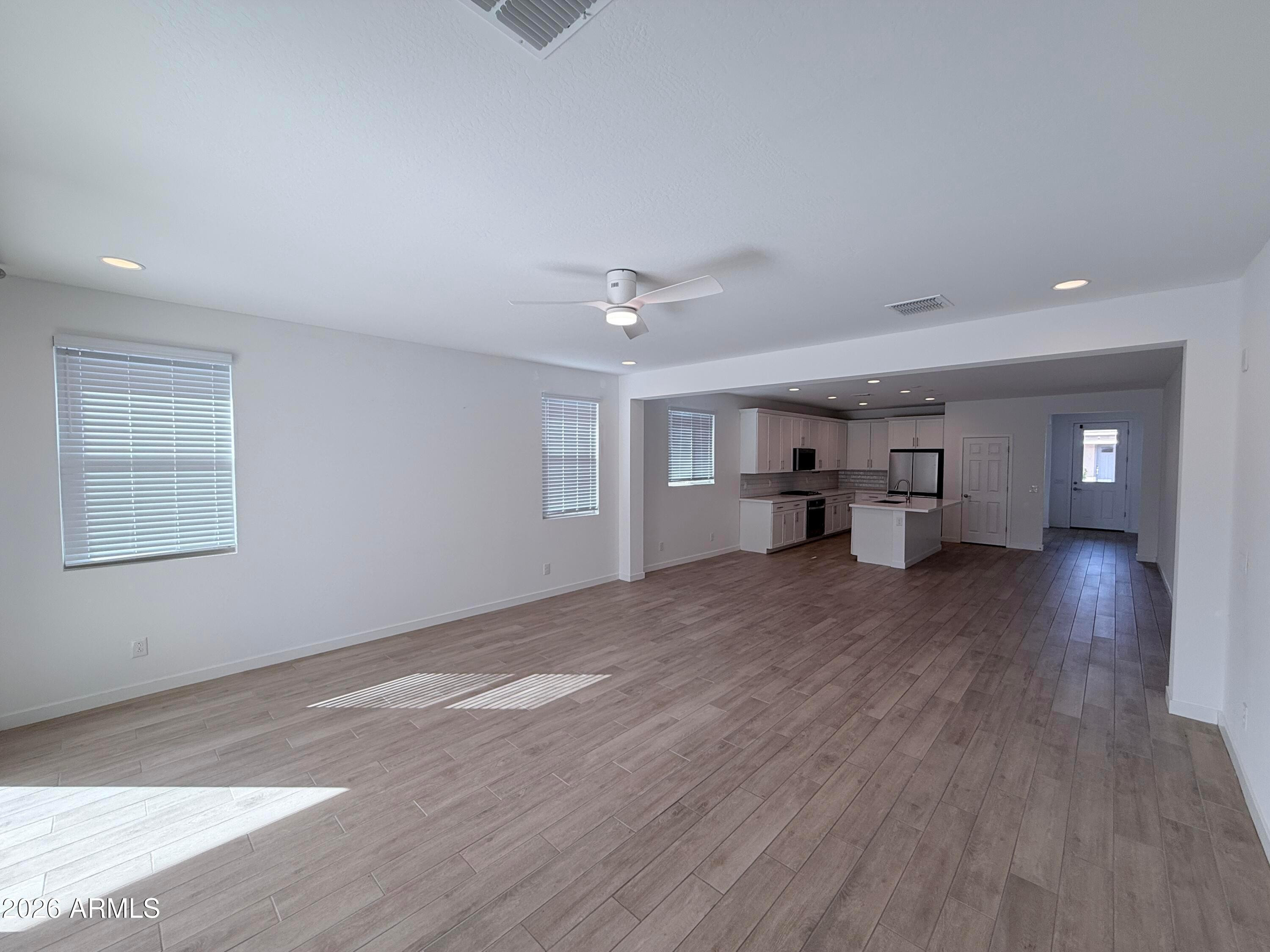 4323 West Palace Sta Road New River, AZ 85087 - Photo 9 of 20 a view of empty room with wooden floor