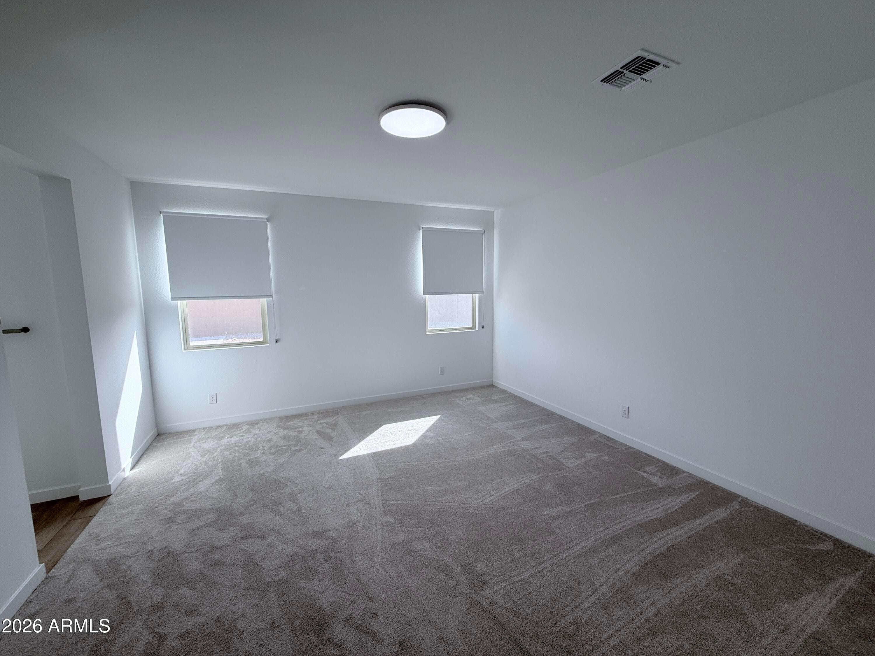 4323 West Palace Sta Road New River, AZ 85087 - Photo 10 of 20 an empty room with windows