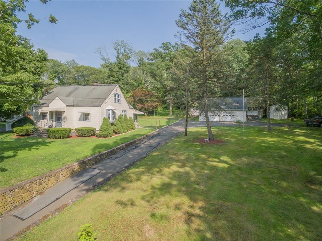 2231 Foxon Road North Branford, CT 06471 - Photo 1 of 1 Four bedroom cape style home set back off the road with a deep, private yard and mature trees.