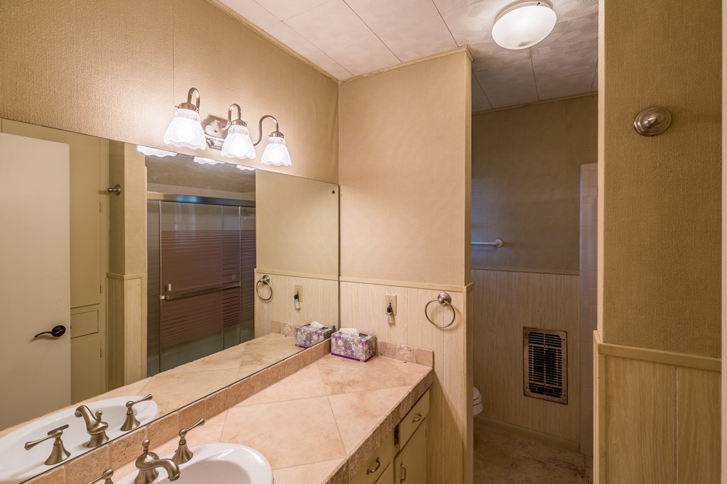307 Frederick Road Fredericksburg, TX 78624 - Photo 11 of 14 a bathroom with a sink and mirror