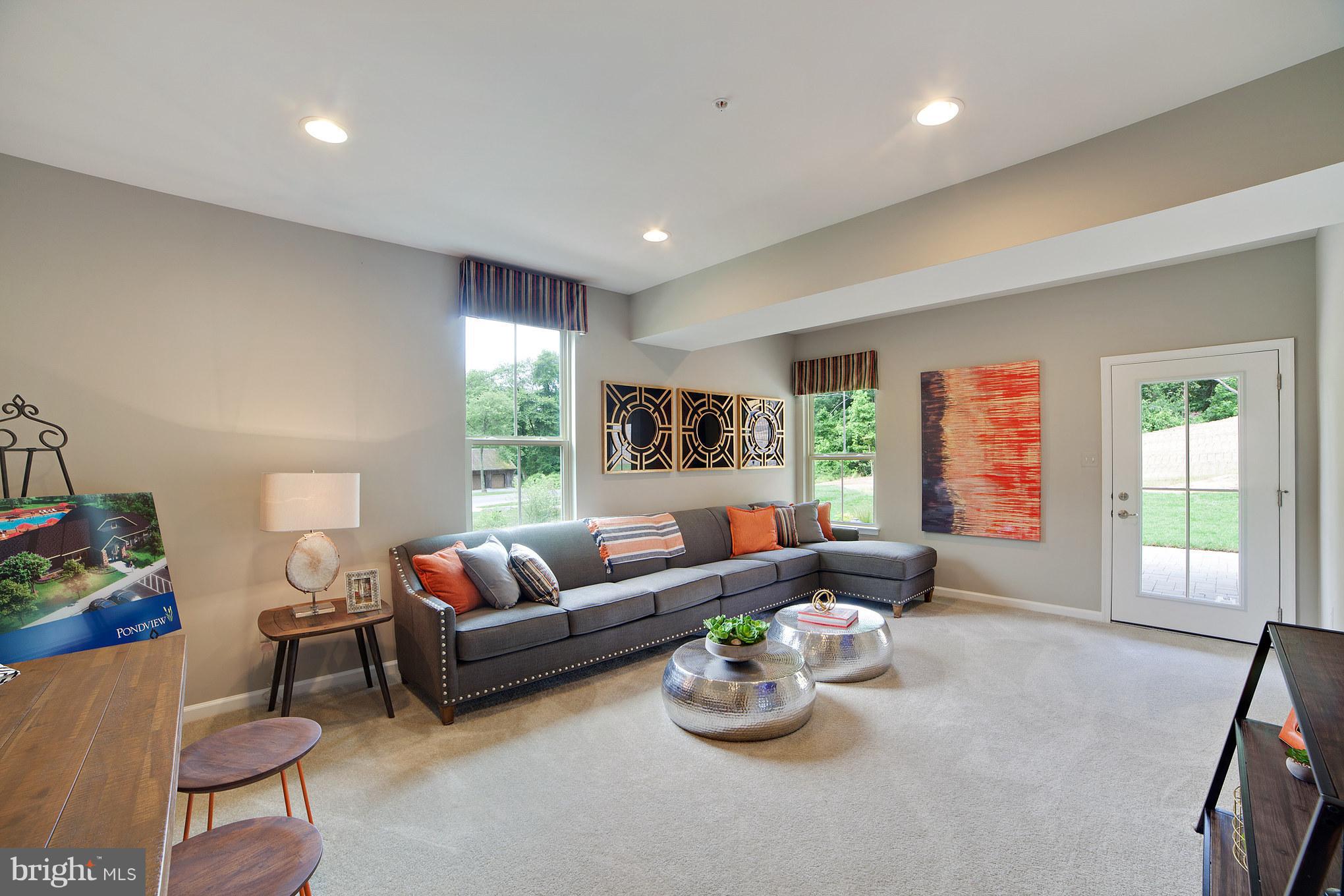 8283 Kippis Road Millersville, MD 21108 - Photo 18 of 28 a living room with furniture and a window